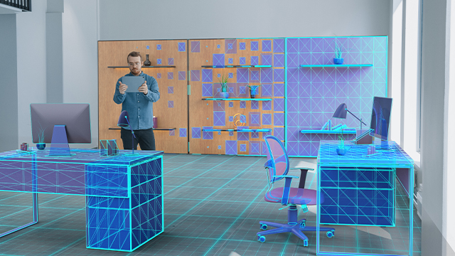Boss of company using Augmented Reality to create the office space layout 