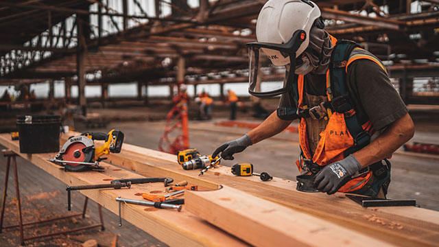 Builder at work with tools