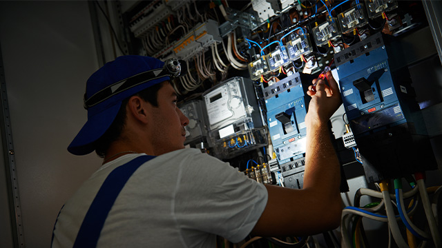 Electrician working on powerboard