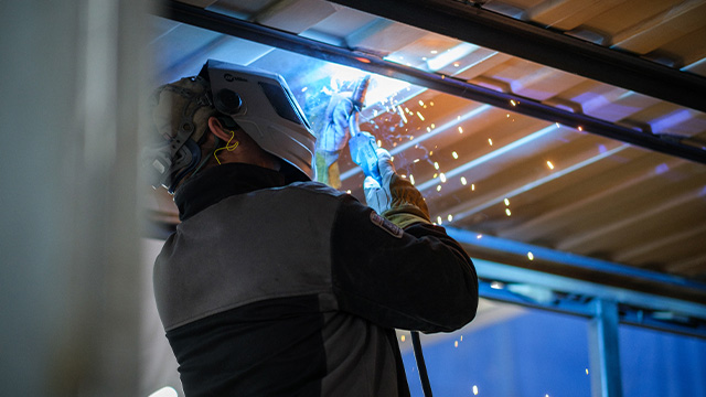 Worker Manufacturing With Medals and Welding