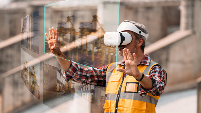 construction male worker using virtual reality to view the scope of his works