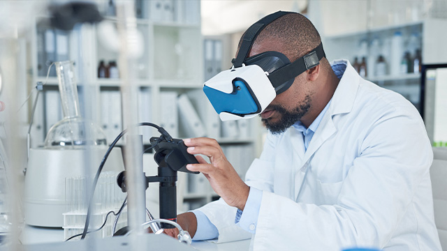 Male scientist wearing a virtual reality device for research
